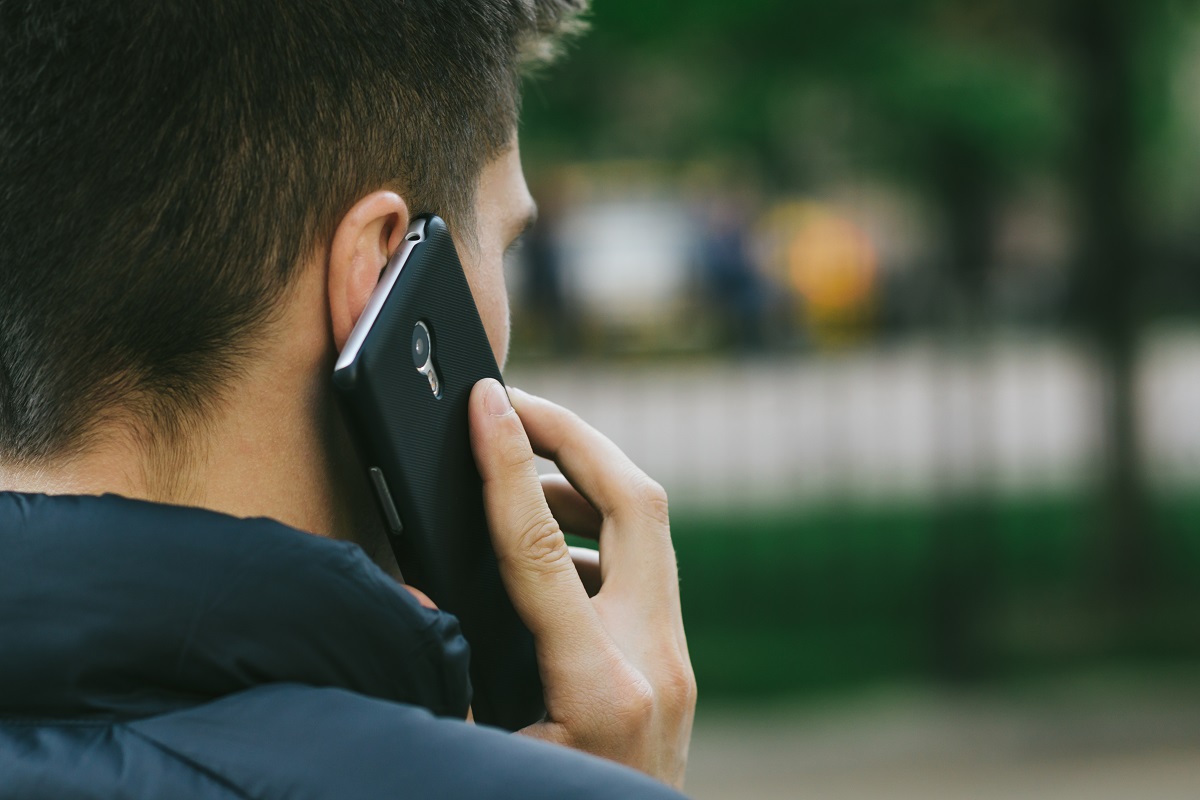 Man calling a mental health helpline