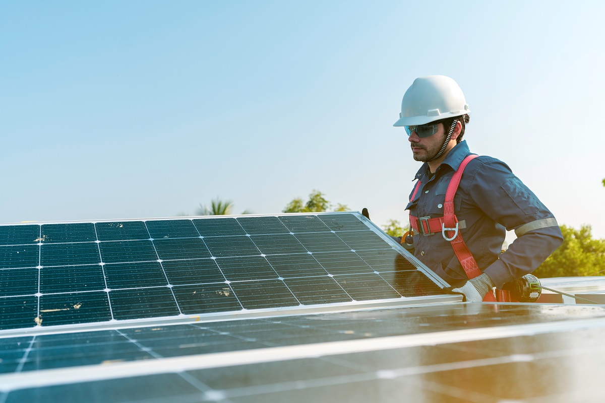 Man working with solar panels