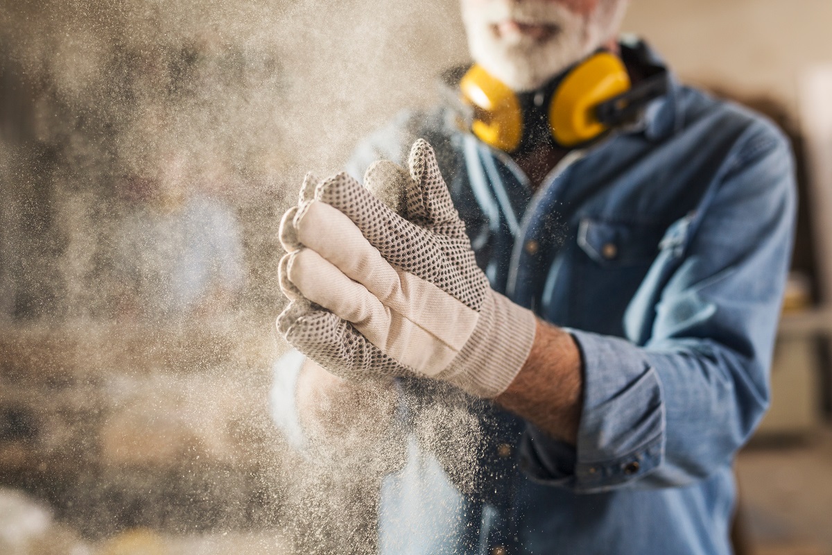 Carpenter wearing PPE gloves