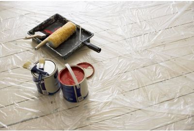 A plastic sheet protecting the floor from paint