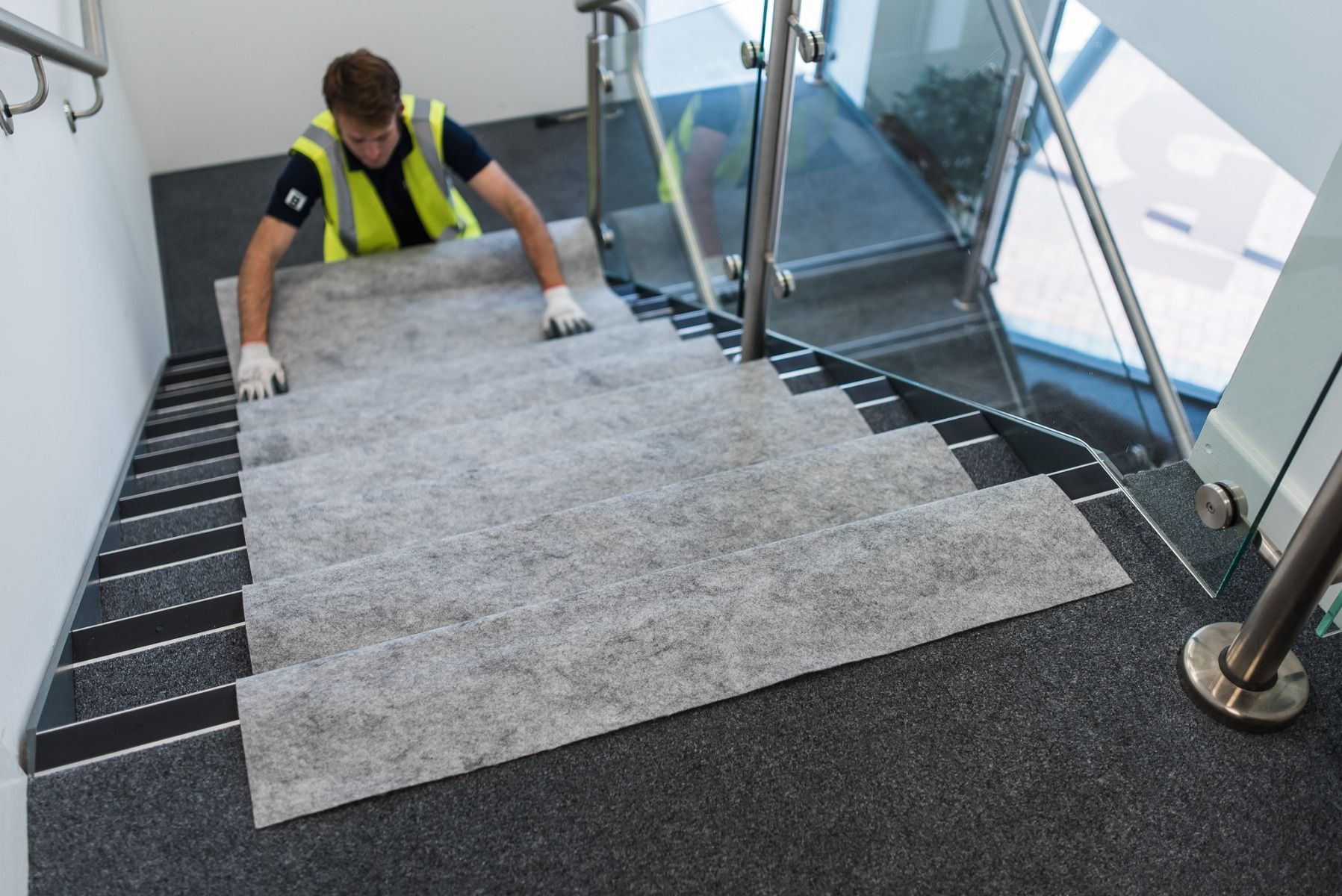 Worker laying stairs protection - Floor protection