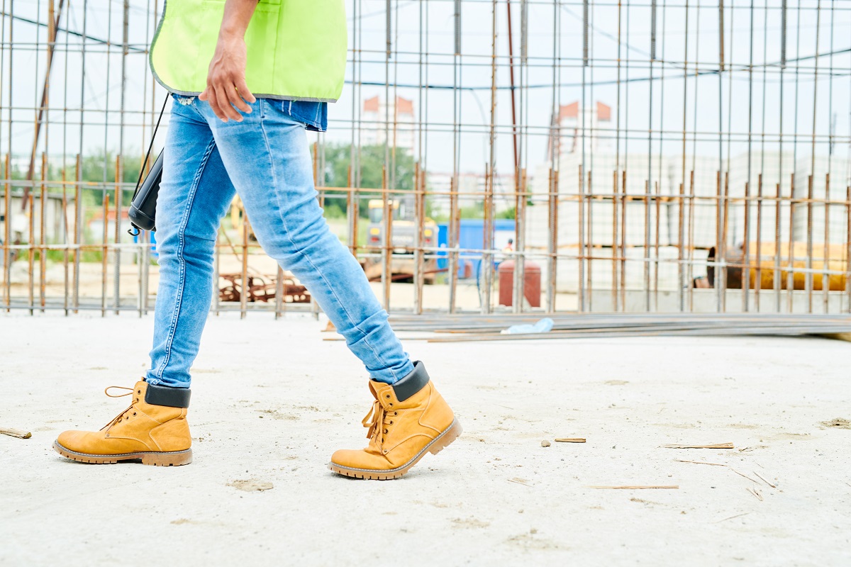 A builder wearing steel toe-cap boots