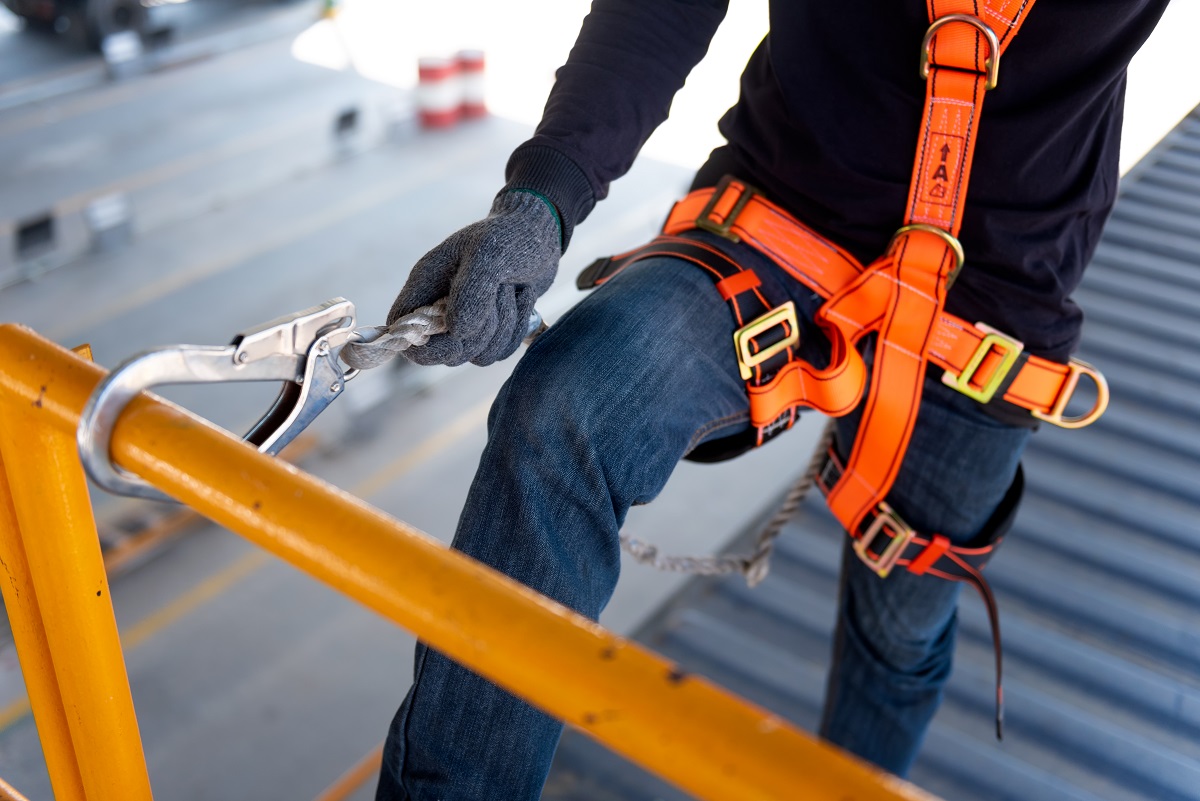 Construction site working using a safety harness