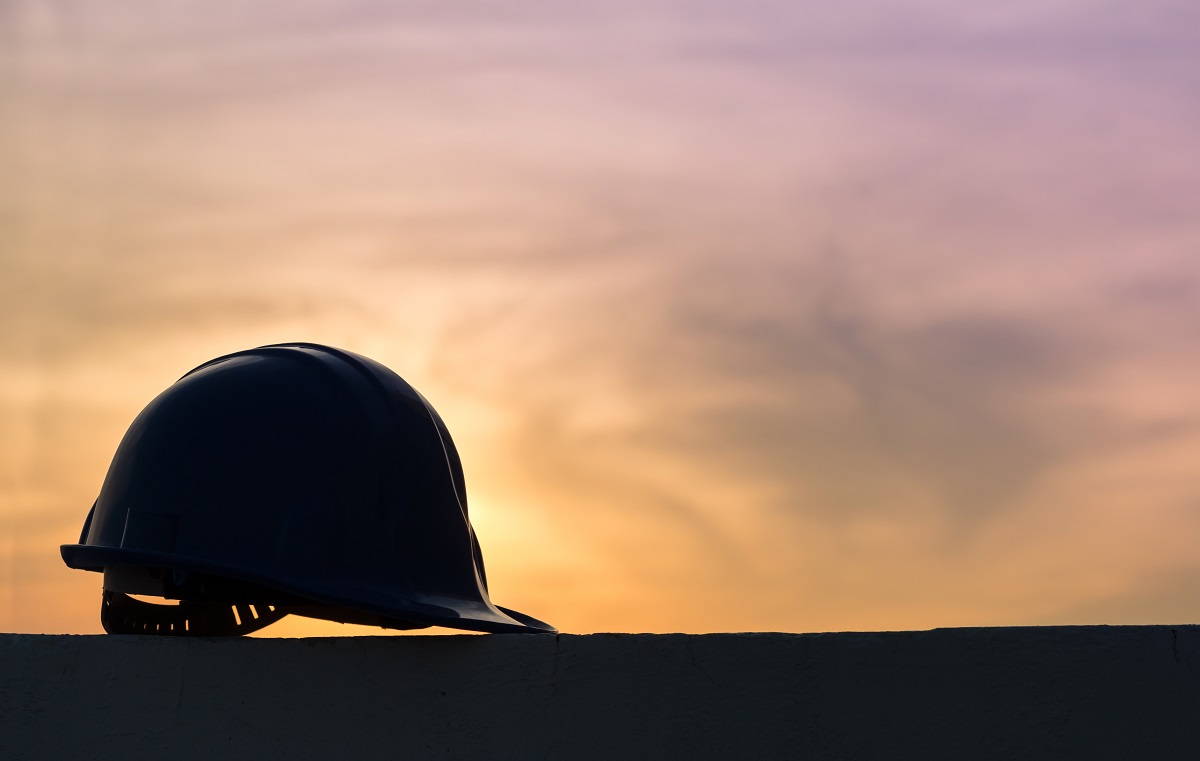 A silhouette of a hard hat