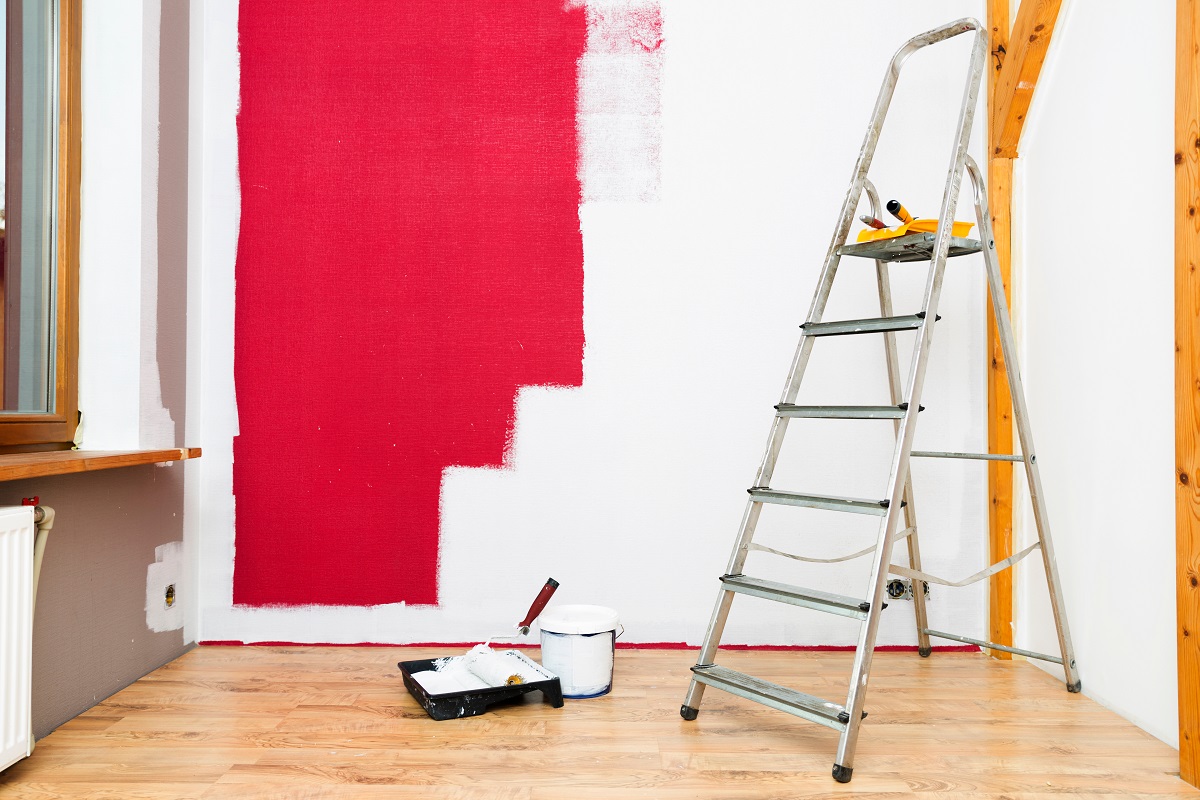 A wall being painted red