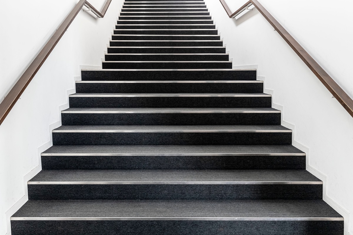 A staircase with two handrails