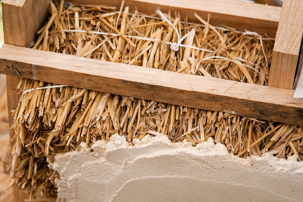 Straw being used for insulation in a wall